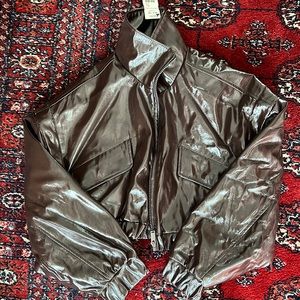 Brown patent leather cropped bomber jacket. New with tags.